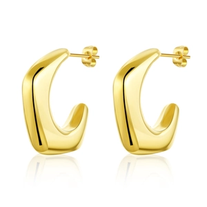 Detailed view of polished gold C-shape moon earrings with high-gloss mirror finish