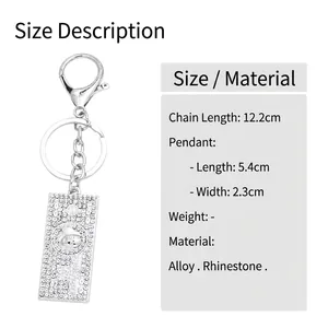 Sparkling crystal dollar bill keychain with rhinestones and silver lobster clasp on white background