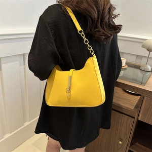 Bright yellow chic underarm shoulder bag with metal buckle and chain leather strap