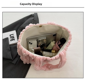 Pink plush tote bag with magnetic closure showing large capacity for tablet and phone