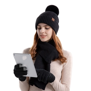 Winter 3-piece knit set with black pompom hat, scarf, and touchscreen gloves for women