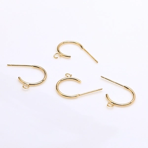 Macro view of 18k gold plated S925 silver C-shape earring posts for DIY jewelry making