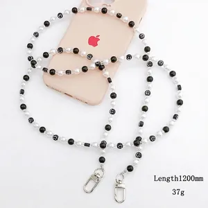 Beaded crossbody phone strap in black and white with smile faces and 120cm metal hooks