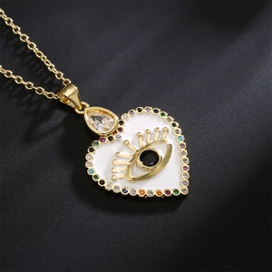 18K gold plated heart necklace with evil eye pendant and colorful zircons on black background