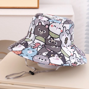 Detail view of cotton kids bucket hat featuring cartoon animal prints and adjustable chin strap