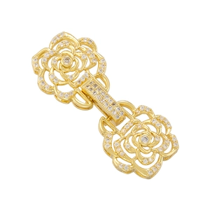 Close-up of golden dual-rose connector clasp with sparkling zircon stones for jewelry