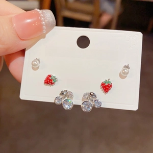 Detail of S925 silver stud earrings set featuring red strawberry, cherry, and pearls
