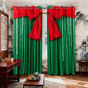 Detail of green blackout curtains with red bow print and silver metal grommets at the top