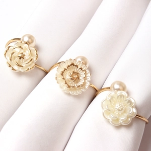 Elegant gold rose napkin rings with white pearl center for wedding table decoration
