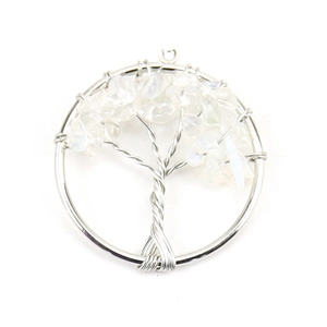 Macro view of Tree of Life pendant with silver wire and translucent white crystals