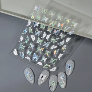 Macro view of 3D iridescent shell butterfly nail stickers with holographic laser texture