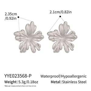 Macro view of flower-shaped stainless steel earrings showing dimensions and petal texture