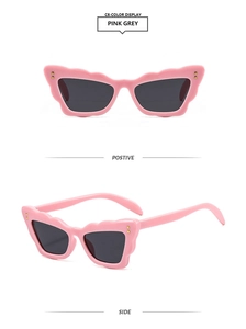 Detailed front and side views of pink wavy cat-eye sunglasses with gold rivets