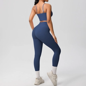 Detail view of navy blue high-waist yoga set with a racerback sports bra and leggings