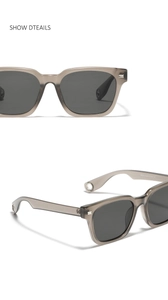 Detail showing square translucent grey frames and metallic ring accents on the sunglasses