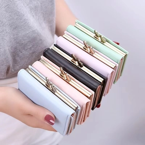 Three-fold leather mini wallet for women featuring golden butterfly clasp in five pastel colors