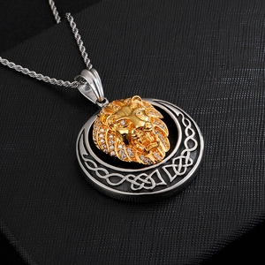 Close-up of hip hop lion head pendant with gold plating and sparkling crystals