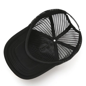 Internal view of black trucker hat showing mesh panels and adjustable snapback closure