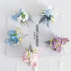Five-piece set of elegant artificial flower boutonnieres in various colors with pearls