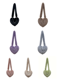 Seven colorful plush heart-shaped crossbody bags featuring metallic chain details