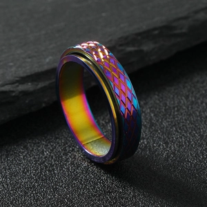 Rainbow stainless steel 6mm spinner ring with textured diamond-cut mesh pattern
