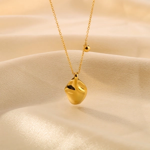 Irregular lava pendant necklace in 18K gold plated titanium steel for a modern look