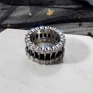 Macro shot of S925 sterling silver ring with three rows of AAA cubic zirconia and black gems