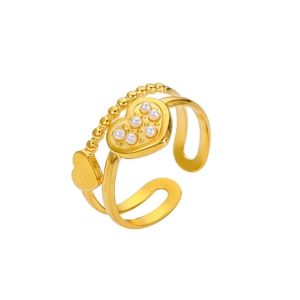 Detail of gold double-layer open ring featuring heart shape and white pearl accents