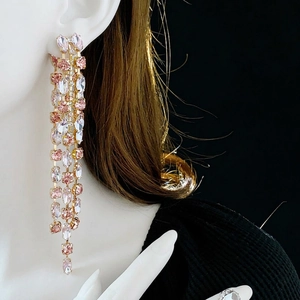 Elegant long tassel drop earrings with pink and white crystals on a gold base