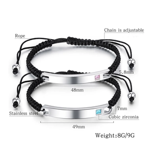 Close-up of adjustable woven couple bracelets with polished steel plates and inlaid zircons