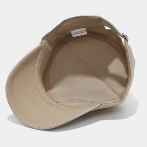 Detail view of khaki cotton military cap interior showing stitching and 100% cotton label