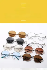 Detail of round metal sunglasses with textured wavy temples in eight assorted colors
