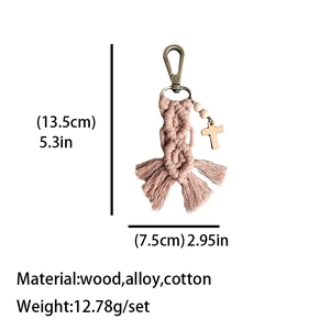Handmade boho woven keychain with nude pink cotton cord, wood beads, and a cross pendant