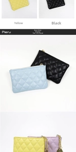 Close-up of quilted coin purse showing zipper detail and functional metal chain link