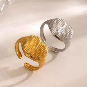 Minimalist stainless steel heart rings with vertical textured stripes in gold and silver