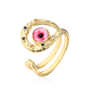 Detail of bohemian gold open ring with pink evil eye and colorful zircon accents