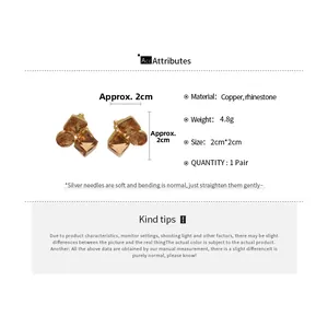 Detail view of square gold-plated rhinestone clip earrings showing size and copper material