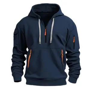 Detail of navy blue fleece hoodie with grey drawstrings and orange zipper accent