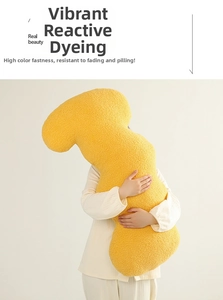 Detail of yellow teddy velvet long body pillow showing soft texture and cozy fabric