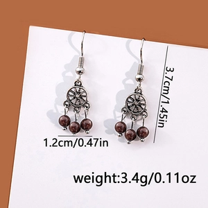 Detailed view of dreamcatcher earrings with size measurements in centimeters and inches