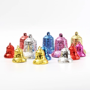 Colorful embossed Christmas bells in gold silver and red for festive wreaths
