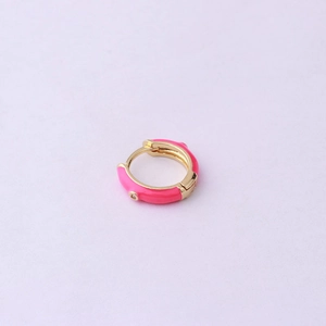 Detail of pink enamel gold hoop earring with a small sparkling cubic zirconia gemstone