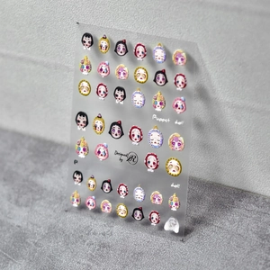 Detailed 5D embossed nail stickers featuring cute puppet doll head designs and relief textures