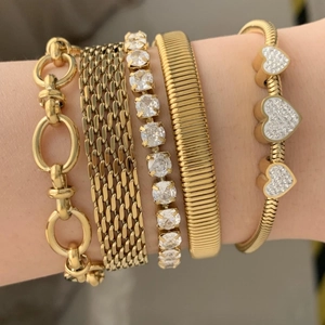Set of five gold-toned stainless steel bracelets with heart charms and crystal stones