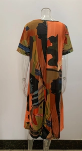 Back view of a short-sleeve summer maxi dress featuring a colorful geometric abstract print