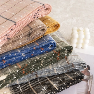 Classic checkered wool blend scarves in various colors with fringe and knit texture