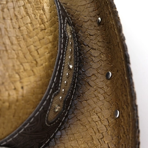 Detailed close-up of dark brown woven cowboy hat with studded leather band and white stitching
