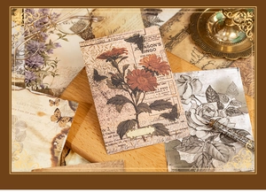 Detail of vintage floral stationery with gold stamping and butterfly designs for journaling