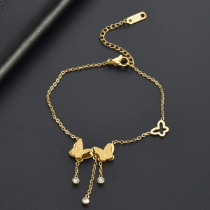 Frosted butterfly tassel bracelet in gold finish with sparkling crystal accents
