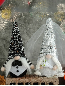 Detail of bride and groom gnomes featuring silver sequins, white lace veil and bouquet